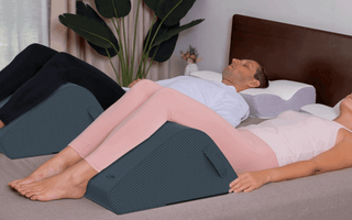 man relaxing with legs elevated on ergonomic wedge during evening rest routine