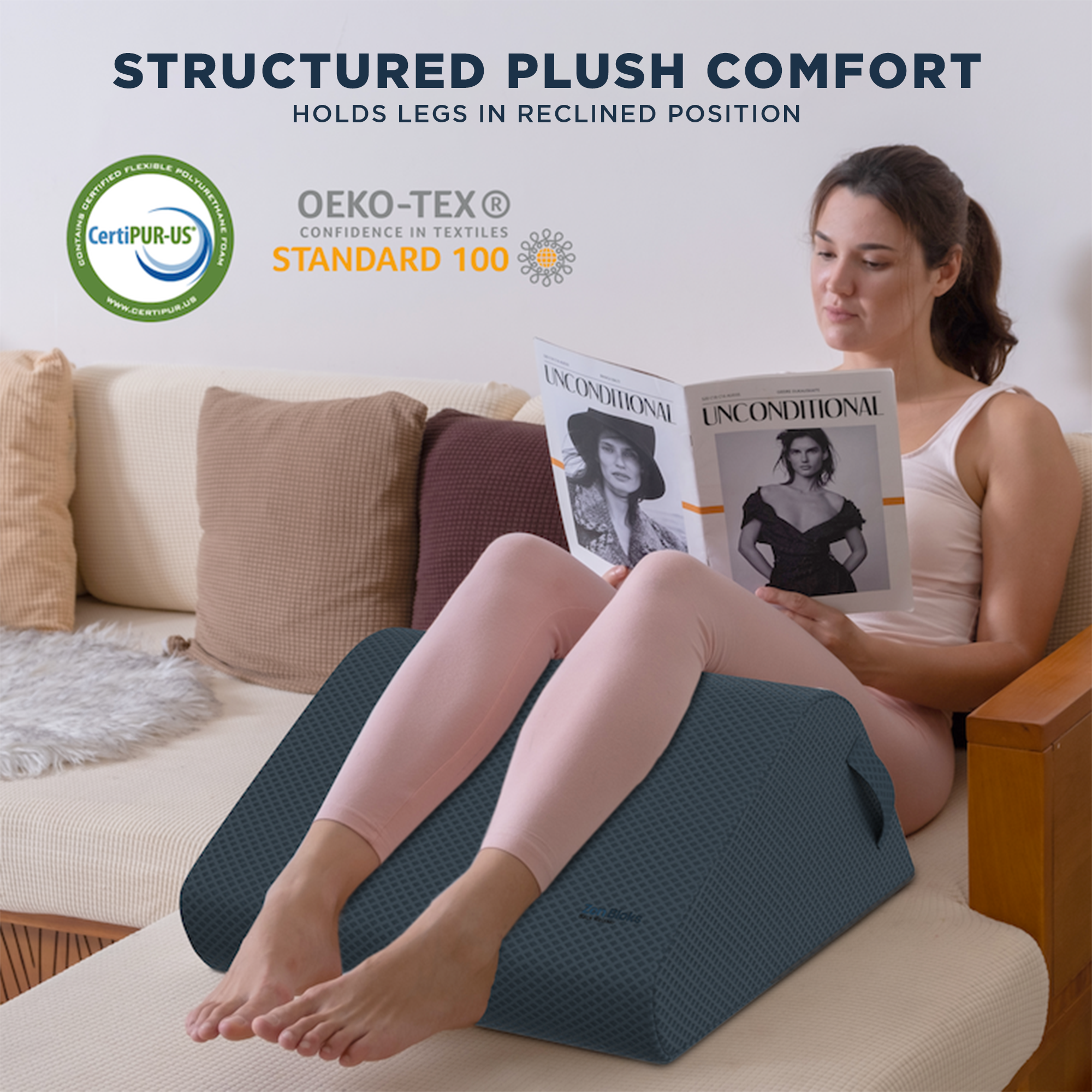 Woman using a leg elevation pillow with 'Structured Plush Comfort' text and CertiPUR-US and OEKO-TEX logos.